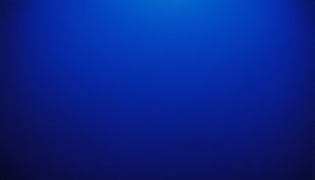 A smooth deep blue gradient transitions from a lighter shade at the to a darker tone at the bottom, creating a...の素材