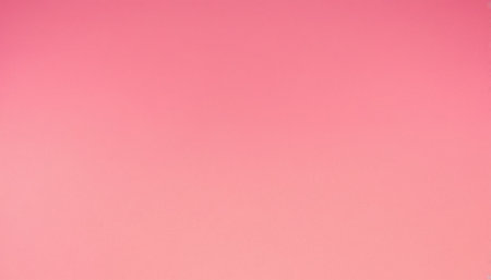 A smooth pink gradient background exhibiting subtle color variations and gentle, diffused lighting across its surface.の素材