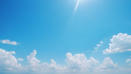 13t092616.097 showing sunlight illuminating scattered white clouds in a bright blue sky. resolutionの素材