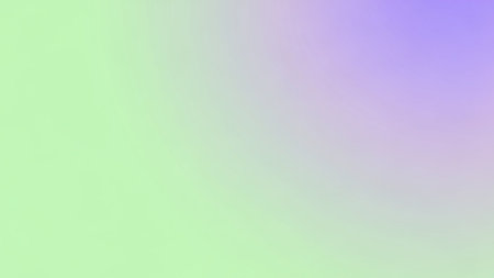 A soft gradient transition from pale green on the left to light purple on the right, creating a gentle abstract...の素材