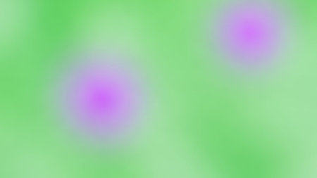 A soft, blurred abstract background featuring two luminous magenta circles against a light green field.の素材