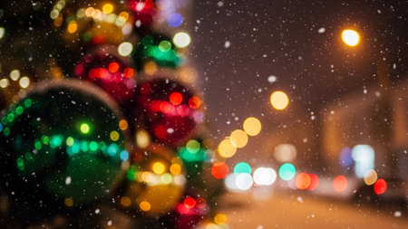 City showing close-up of blurry christmas ornaments with falling snow and bokeh lights at night keywords: christmas,...の素材