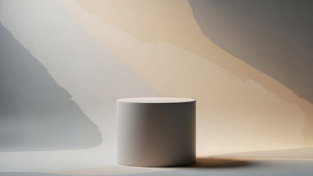 A minimalist cylindrical podium stands on a white surface, illuminated by soft, abstract pastel colored light and...の写真素材