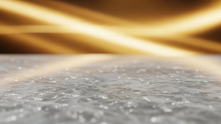 A close-up view of a rippling water surface with bright golden light streaks reflecting on its...