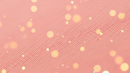 A soft pink textured fabric with diagonal lines is overlaid with scattered golden bokeh lights and...