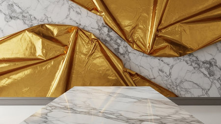 gold fabric drapes over a white marble wall, with a marble table in the foreground.の写真素材