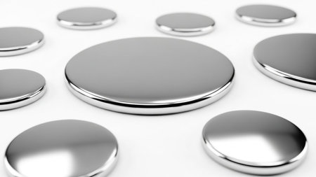 With showing scattered silver metallic discs with reflective surfaces on a white background. resolutionの写真素材