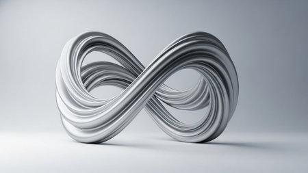 A smooth, metallic silver infinity symbol sculpture with a twisted, ribbon-like form is displayed on a light gray...の写真素材