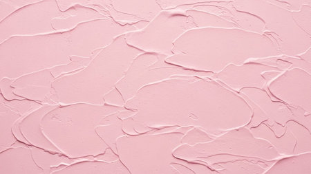 Showing textured pastel pink cosmetic cream or plaster with thick impasto strokes and visible ridges...の写真素材
