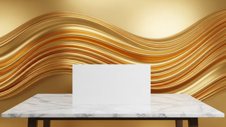 A white blank card sits on a marble table in front of a flowing, wavy golden fabric background with a sheen.の写真素材