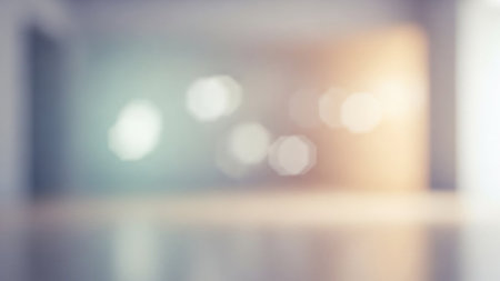 Softly blurred octagonal lights in cool blue and warm orange hues create a serene, outoffocus atmosphere within an...の素材