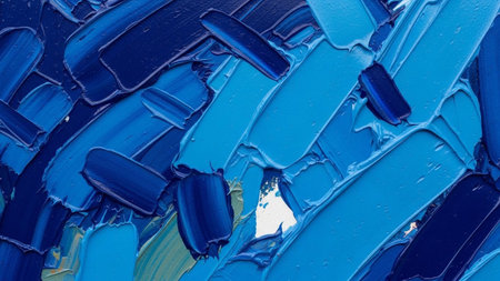 This is a close-up, abstract featuring thick, impasto brushstrokes of various shades of blue paint. The textured surface the distinct marks of a brush, creating a sense of depth and movement. The colors range from deep navy to bright cerulean, with hints of lighter blues and a small area of white peeking through the layers. The overall impression is one of dynamic energy and artistic expression.の素材