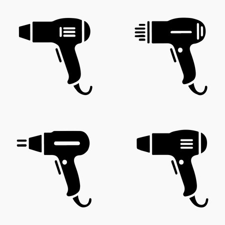 A collection of solid heat gun icons, each presented individually isolated on a clean white background for versatile design use.のイラスト素材