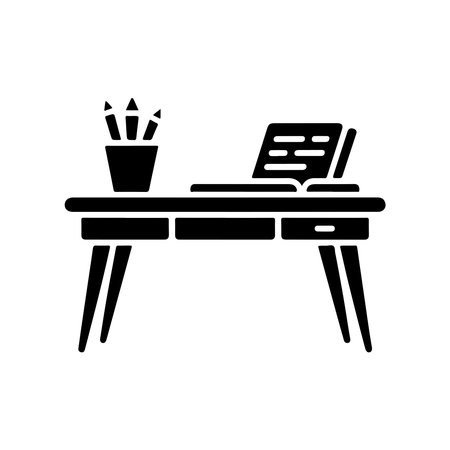 A simple, solid icon representing a writing desk. This graphic is isolated on a clean white background, making it versatile for various design applications.のイラスト素材