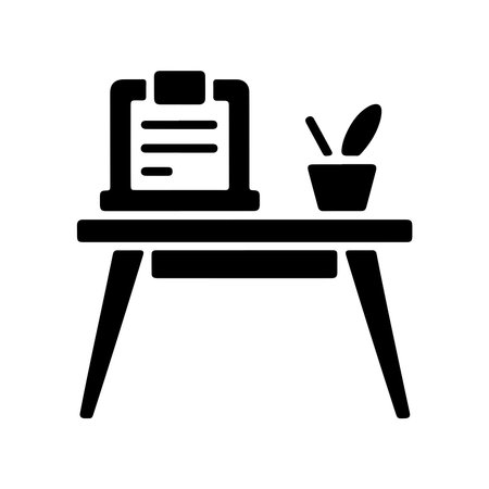 A clean, solid icon representing a writing desk. The graphic is presented isolated on a white background, perfect for digital interfaces or print.のイラスト素材