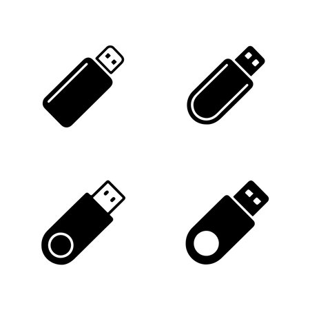 A collection of solid icons representing USB flash drives. Each icon is presented clearly isolated on a white background.のイラスト素材