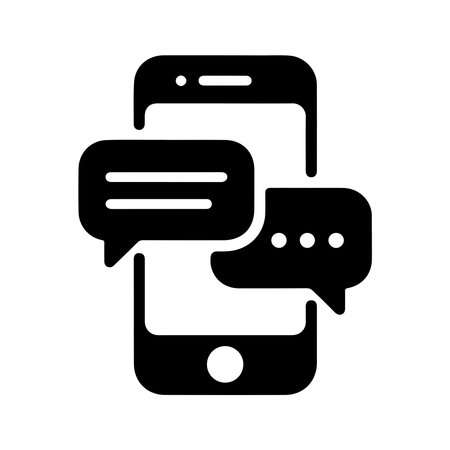 A clean, solid icon representing a smartphone with a chat bubble, presented in isolation on a white background.のイラスト素材