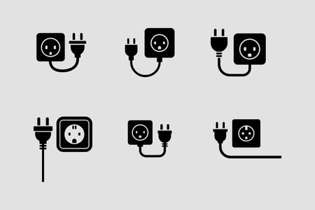 A collection of solid icons featuring a plug socket and cable, presented in a clean, isolated on white background format.のイラスト素材
