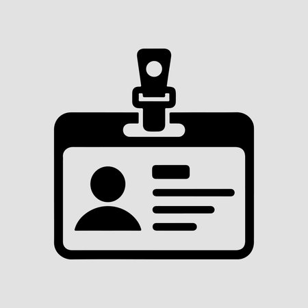 A clean, solid icon representing an ID card holder, presented in isolation on a white background.のイラスト素材