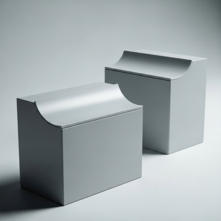 Two identical light gray geometric blocks, each featuring a concave curved top surface, are presented isolated on a clean white background.の素材