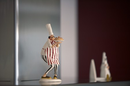 Chef figurine in kitchenの写真素材