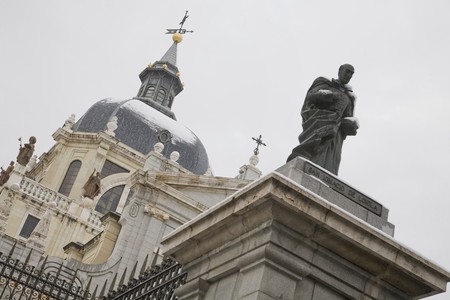 Statue in front of a cathedral, Catedral De La Almudena, Madrid, Spainの写真素材
