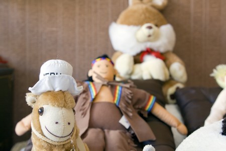 Stuffed toys on the bedの写真素材