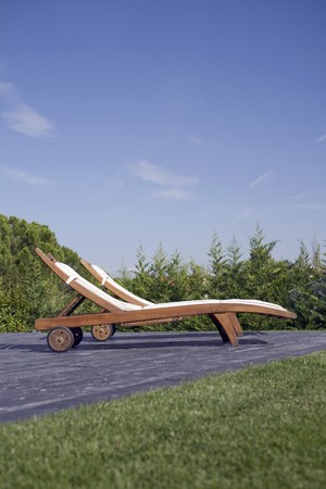 Lounge chairs in a gardenの写真素材