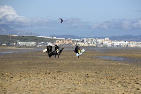 Tourists holding surfboards on the beach, Tarifa, Cadiz Province, Andalusia, Spainの写真素材