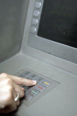 Detail of masculine hand at ATM