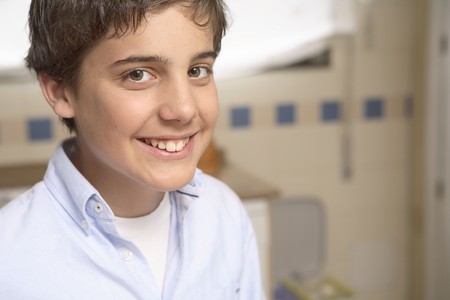 Portrait of 12 years old boy smiling looking at camera.の写真素材
