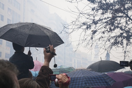 Valencia, 19th of March, 2010. The smell of gunpowder can be felt by the crowd of people that get together to hear every day the great firecracker explotion during the Fallas, in Valencia, Spain.のeditorial素材