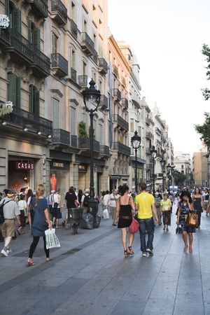 July 2010, Barcelona. Pedestrians walking down Gran Via, one of the most popular shopping streets of Barcelona, Spain.のeditorial素材