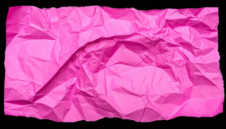 Pink crumpled paper isolated on black background with clipping path.の素材