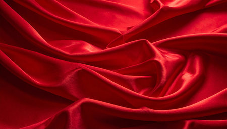 Red satin background with some smooth folds in it; note shallow depth of fieldの素材