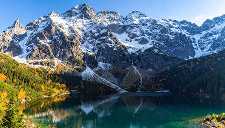 Mountain lake in the autumn season. The concept of active, ecological and photo tourismの素材