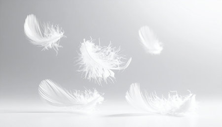 Feathers fly in the air on a white background. Fluffy white feathers fly in the air.の素材