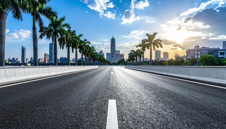 empty asphalt road and modern city skyline in shanghai at sunsetの素材