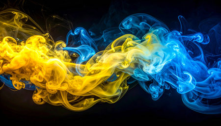 Abstract multicolored smoke of  blue and yellow colors on a black isolated backgroundの素材