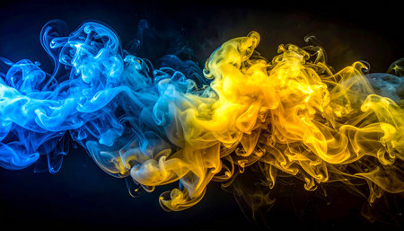 Colorful yellow and blue smoke on a black background. Background from the smoke of vapeの素材