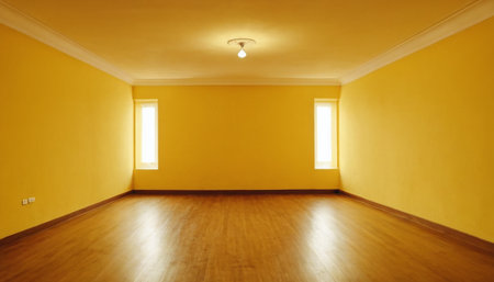 interior of empty room with yellow wall and wooden floor, nobody insideの素材