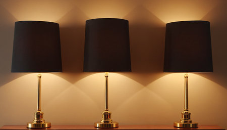 Lamps on a shelf in a room with brown wall and lightの素材