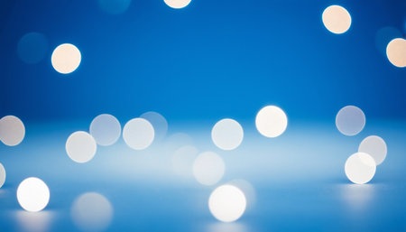 Abstract bokeh background with blue and white lights on blue backgroundの素材