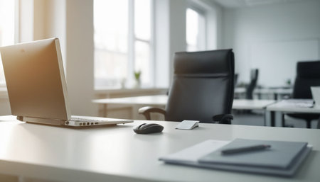 Office workplace with laptop, smartphone and other items. Blurred backgroundの素材