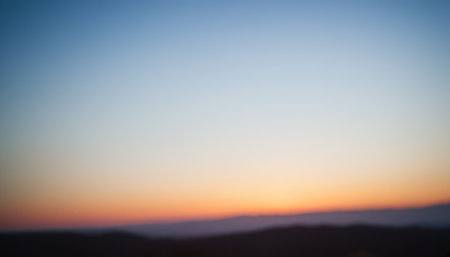 Colorful sunset in the mountains. Defocused background for your design.の素材