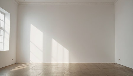 interior of empty room with white walls, concrete floor and windowの素材