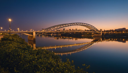 Panoramic view of the old bridge over the river at sunsetの素材