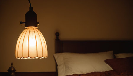 Vintage lamp on the bed in the bedroom. Retro style.の素材