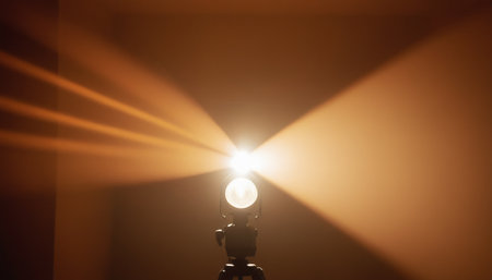 Spotlights in a room lit by warm rays of the sun.の素材