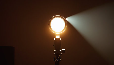 Studio lighting equipment on dark background. Soft focus, shallow DOF.の素材